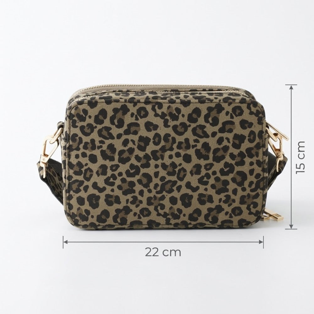 A Marco Tozzi leopard print crossbody camera bag with a top zipper and gold-tone hardware, shown with dimension lines indicating 22 cm width, 15 cm height, and a strap depth of 7 cm on a white background.