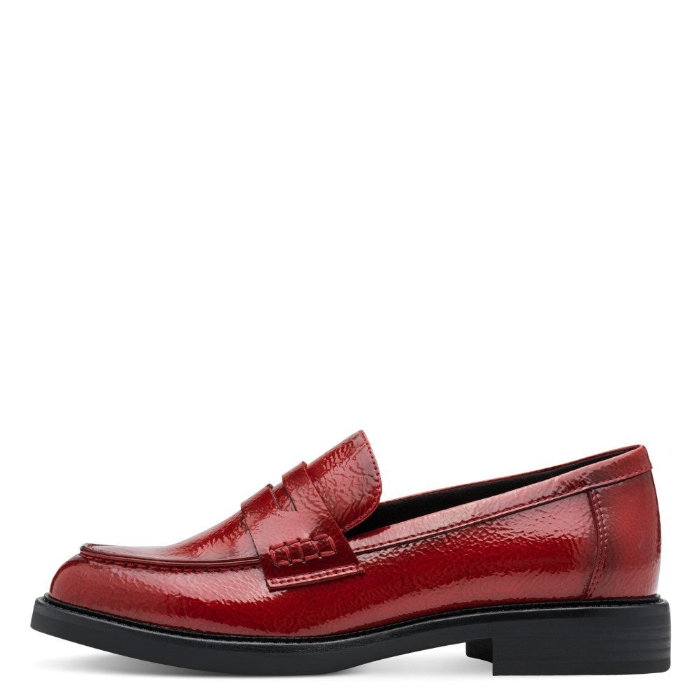 Red loafer shoe with a '100% Vegan' label by Marco Tozzi on a white background Marco Tozzi Patent Vegan Loafer 2-24308