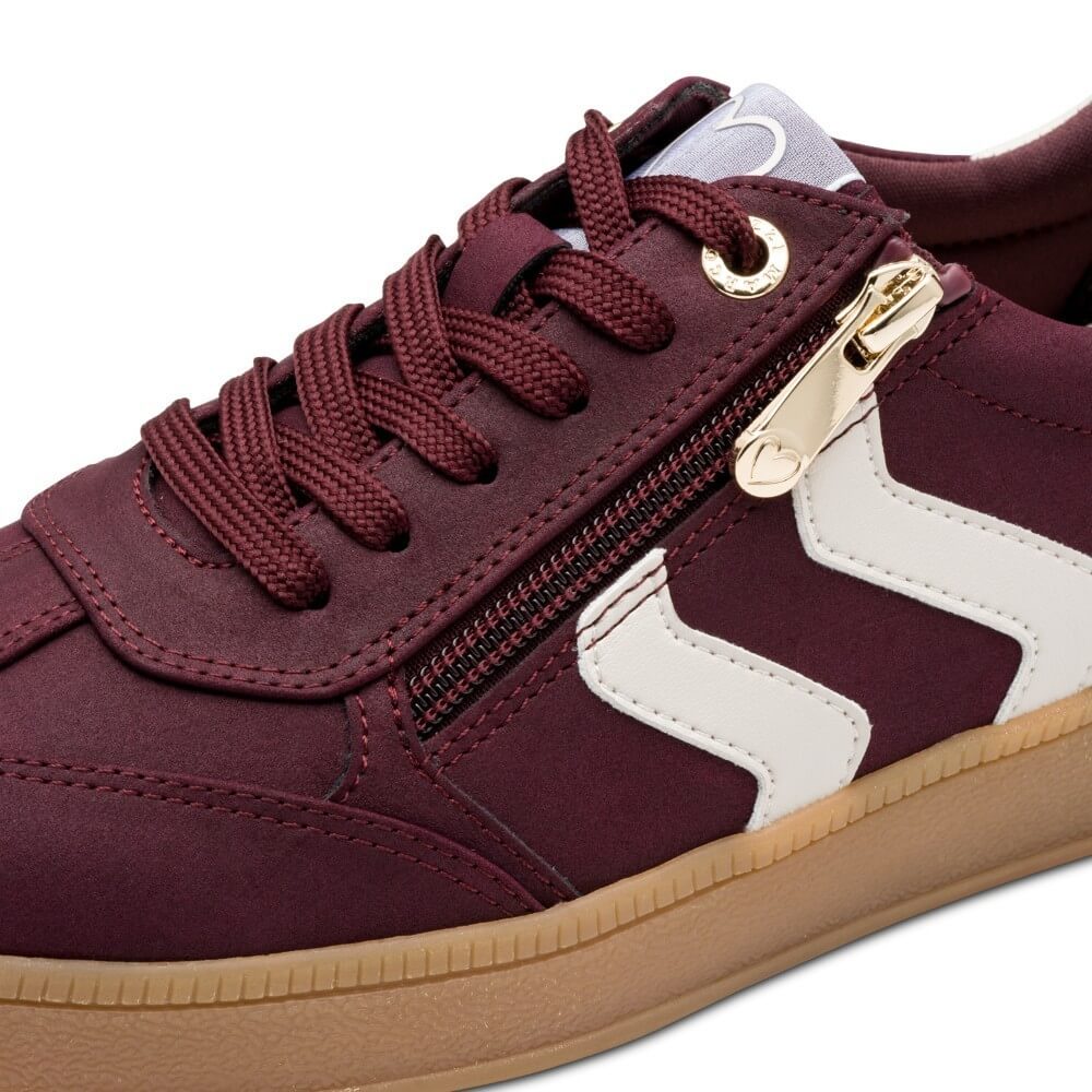 Maroon sneaker with gold zipper and white sole, accompanied by a '100% Vegan' label. Marco Tozzi Vegan Sneakers 2-23739-WINE