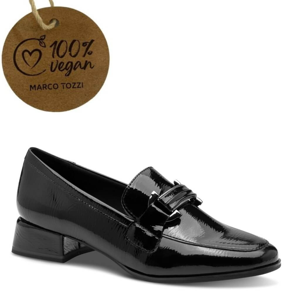 Black patent leather loafer with a '100% Vegan' Marco Tozzi tag on a white background