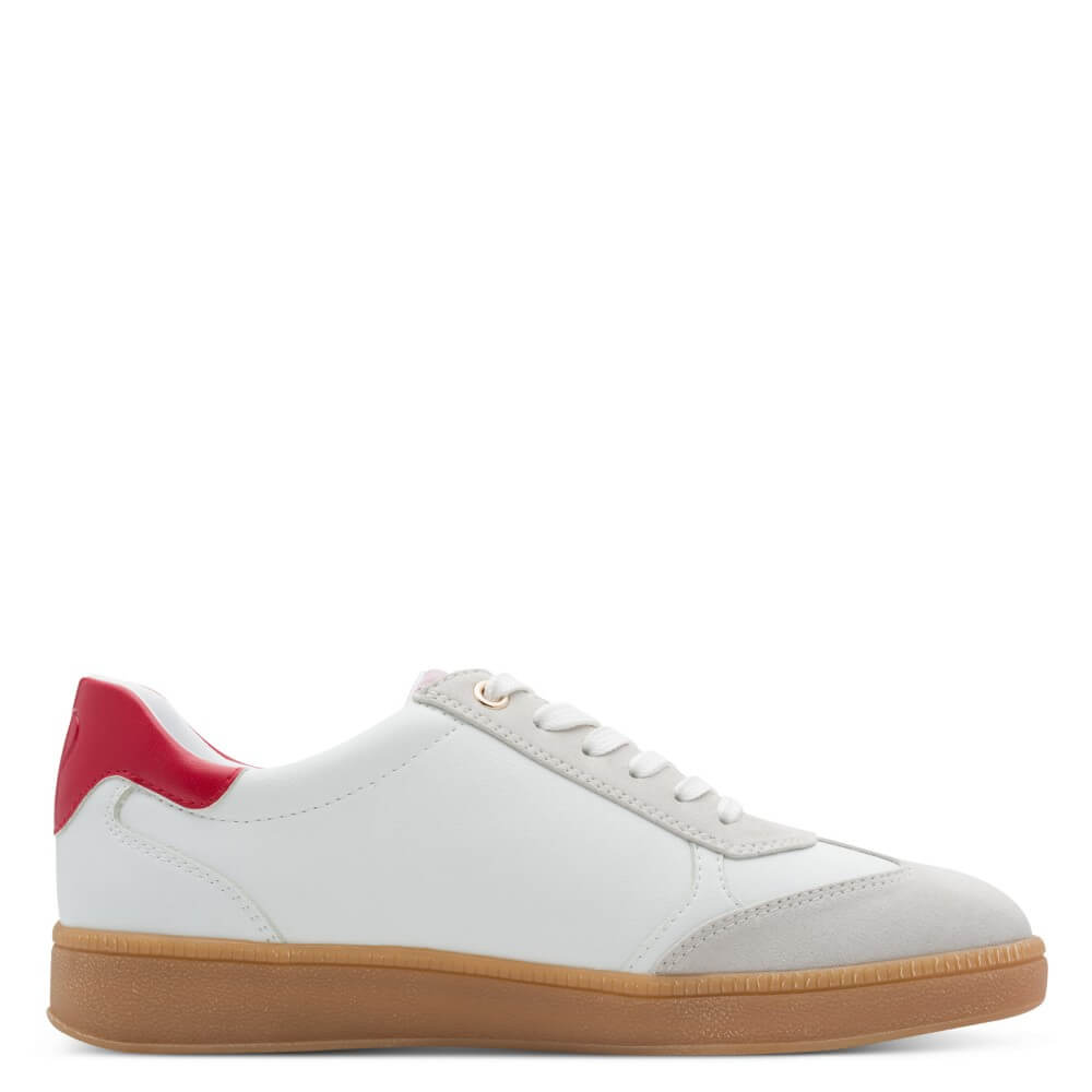 White sneaker with red heel and brown sole on a white background