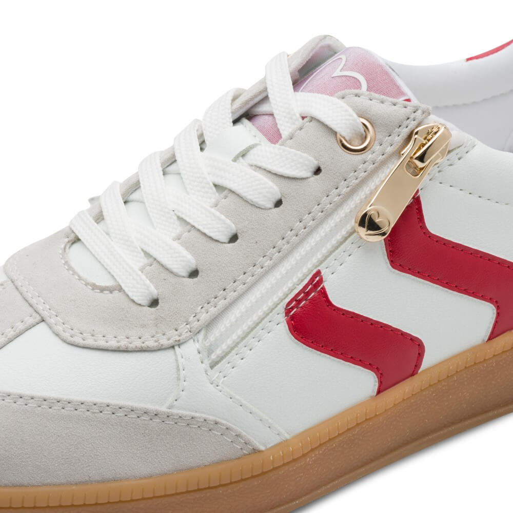 Sneaker with red and gold accents on a white background