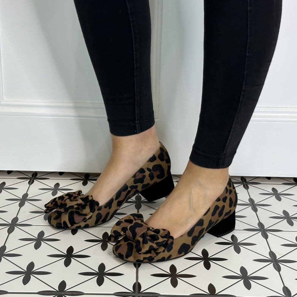 Leopard print shoes worn with black pants on a patterned floor. Marian Ballerina 8217 Leopard Print