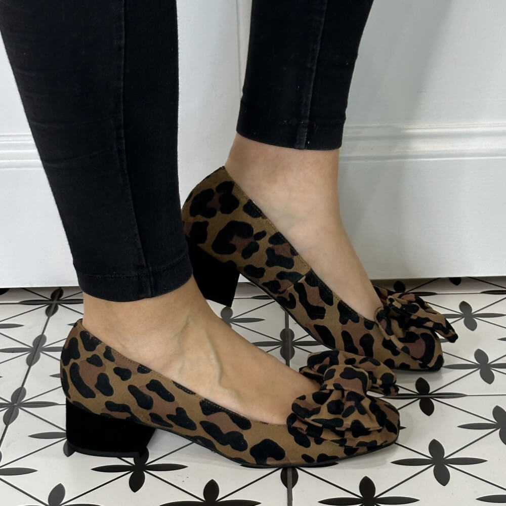 Leopard print shoes worn with black pants on a patterned floor. Marian Ballerina 8217 Leopard Print