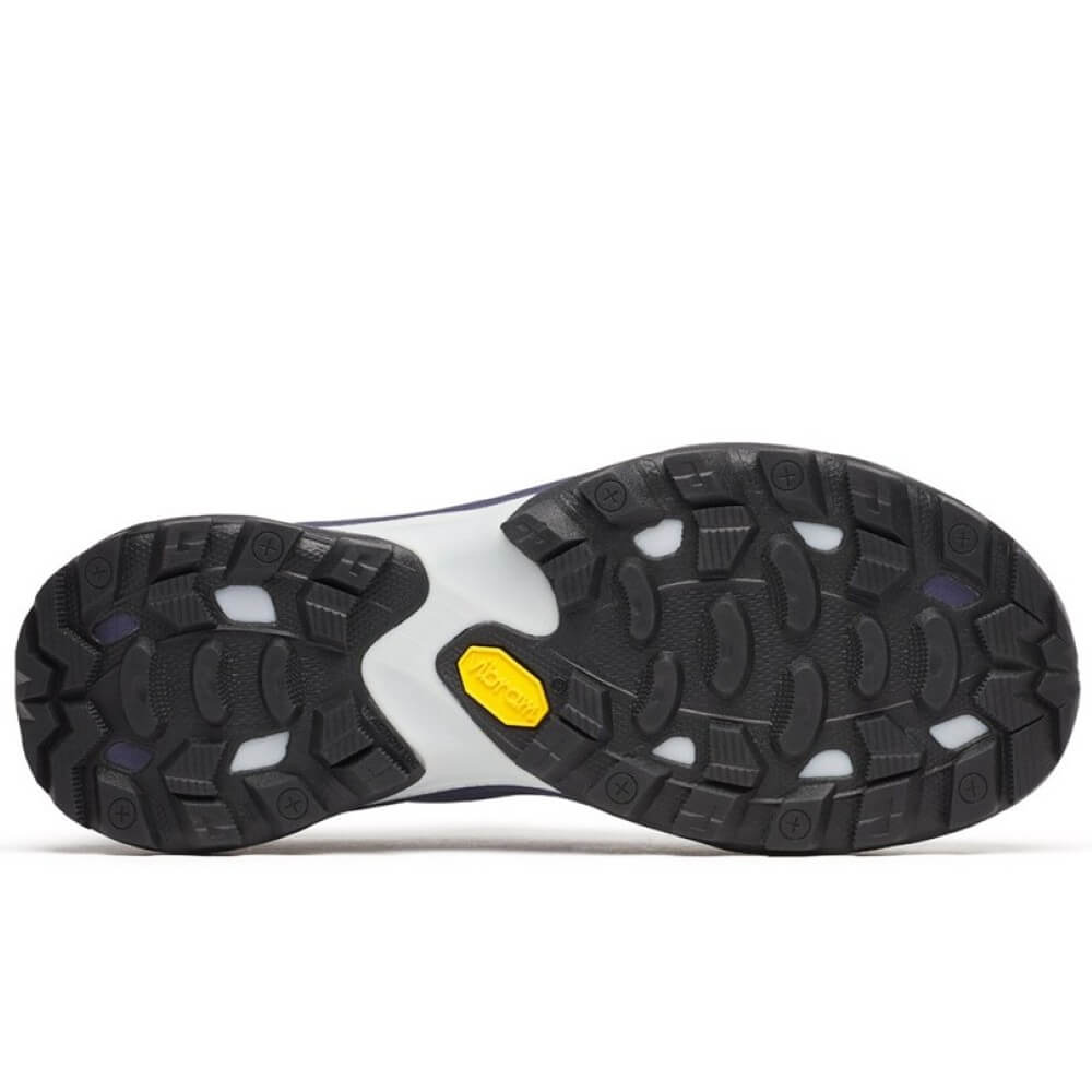 Close-up of a shoe sole with a yellow label on a white background