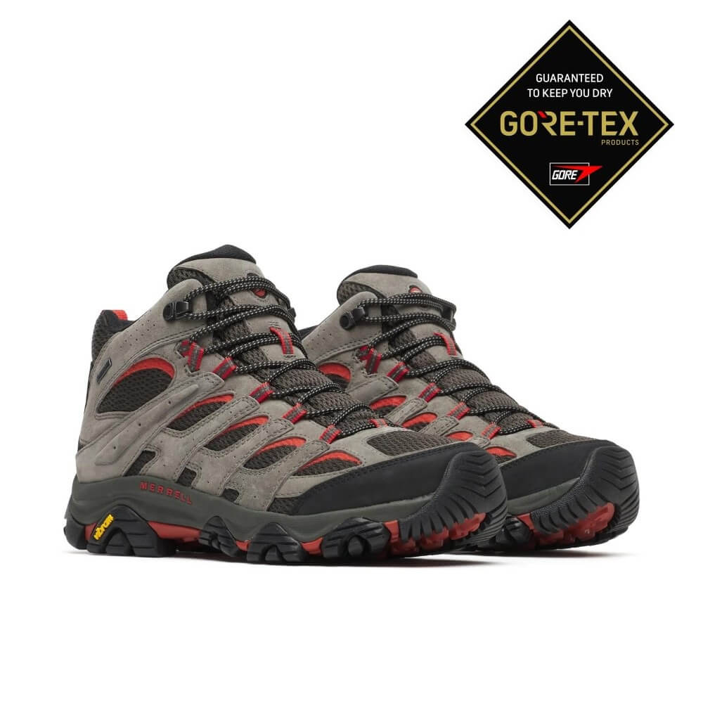 A pair ofMerrell Moab Grey and red Gore-Tex Hiking Boots on a grey background 