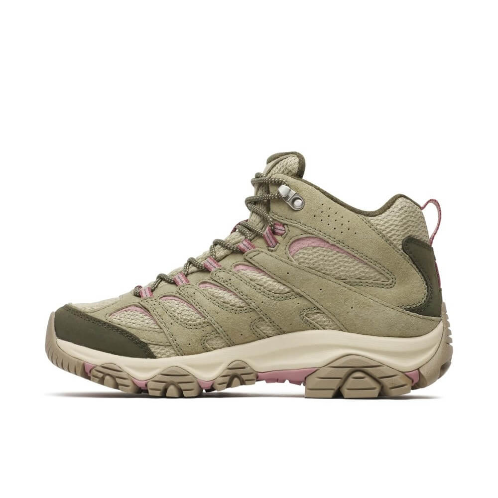 A Merrell mid-cut hiking boot in olive green and beige mesh, featuring pink laces and a small pink heel pull tab, shown from a side profile on a white background.