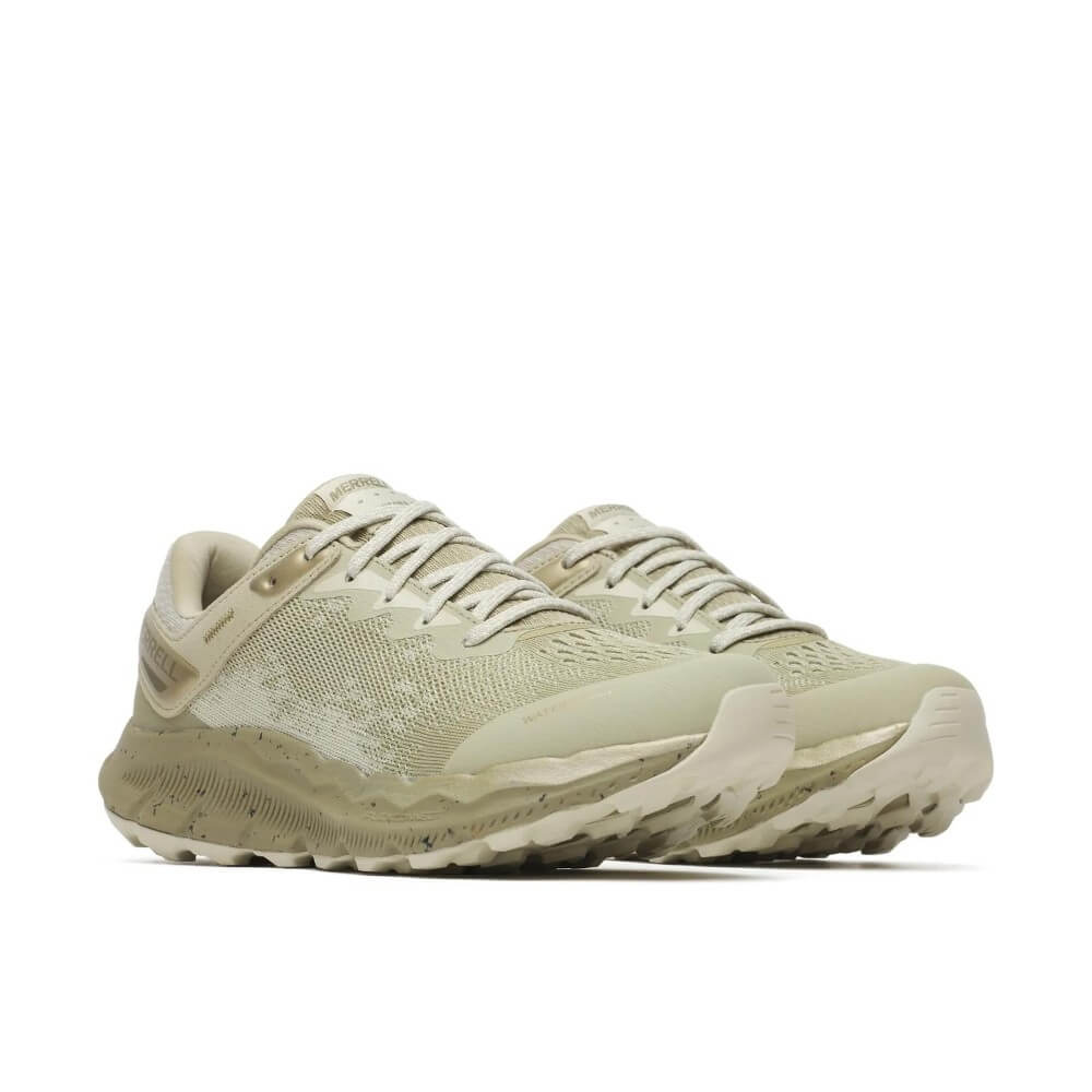A pair of Merrell waterproof running shoe in a light green and beige colourway, featuring a textured knit upper, a speckled white midsole, and a light grey outsole, shown against a plain white background.