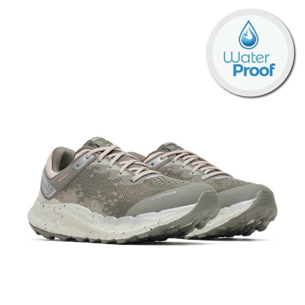 A pair of Merrell grey and beige trail running shoes with a speckled white midsole, shown on a white background with a circular 'Water Proof' badge in the top right corner.