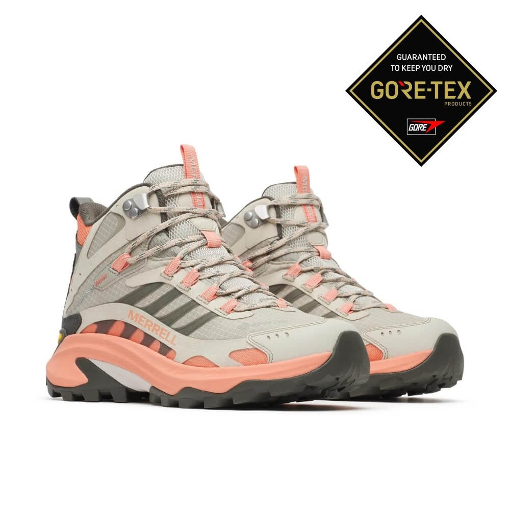 A Pair of Merrell Gore-Tex mid-height hiking boots in light grey and coral pink, featuring a  Vibram sole, shown from a side profile on a white background.