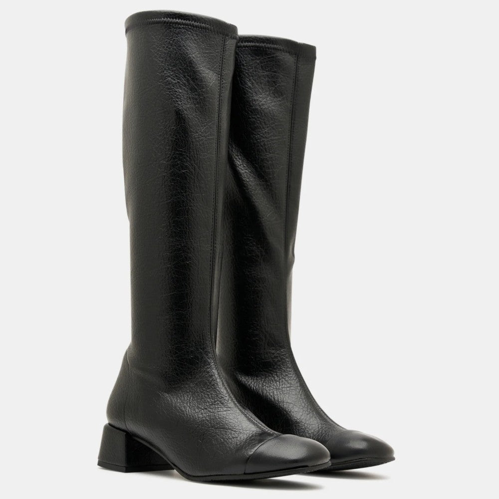 A pair of Miss Elastic black PU leather knee-high boots with low block heels and pointed toes, shown against a plain light grey background.