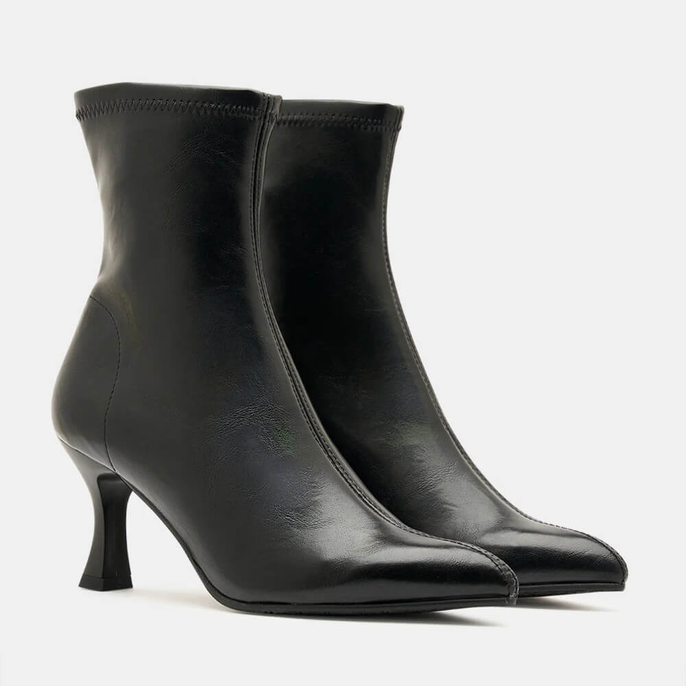 Miss Elastic black Stretch ankle boots with a pointed toes and slim kitten heels, shown in profile against a light grey background.