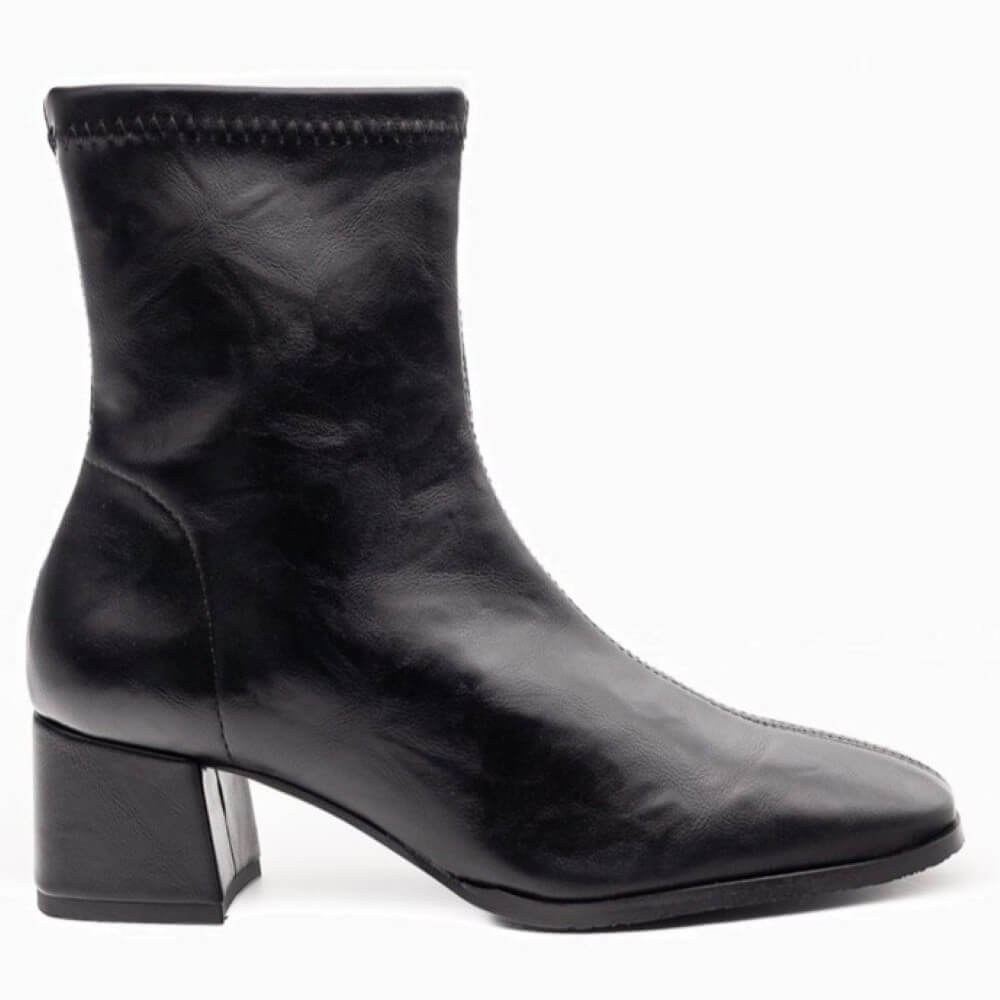 Black ankle boot with a block heel on a white background . Miss Elastic 78330 Ankle Boot