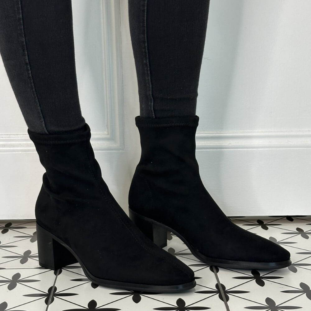 Black elastic Block heel boot worn with black jeans