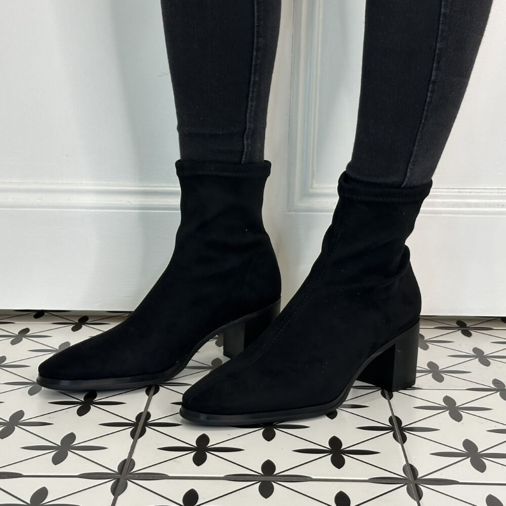 Black elastic Block heel boot worn with black jeans