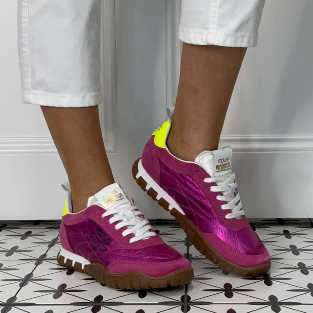 Mjus Pink Purple sneakers with yellow accents worn by a person on a patterned floor.