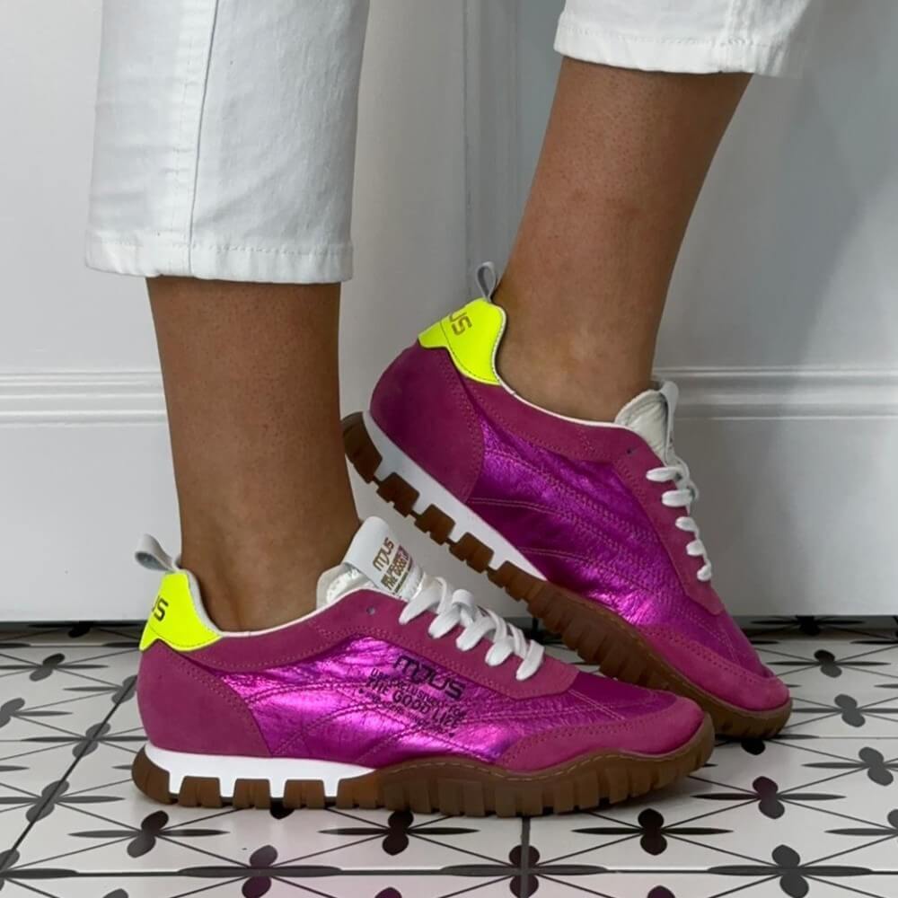 Mjus Pink Purple sneakers with yellow accents worn by a person on a patterned floor.