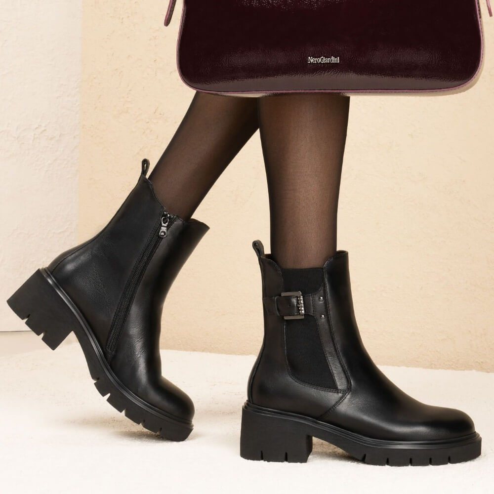 Black Chelsea boot with a buckle on a white background NeroGiardini Leather Chelsea Ankle Boots I514814D Black