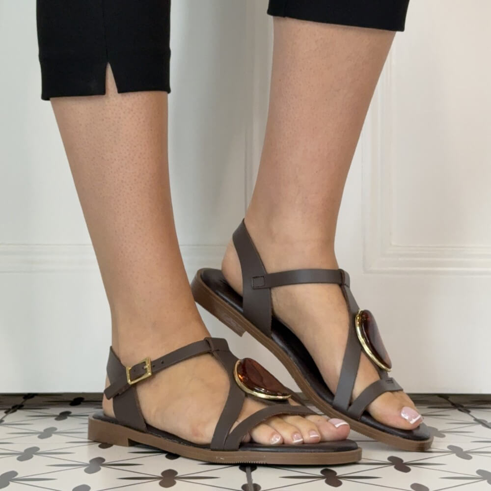 Oh My Sandals Brown sandals worn on feet with a neutral background