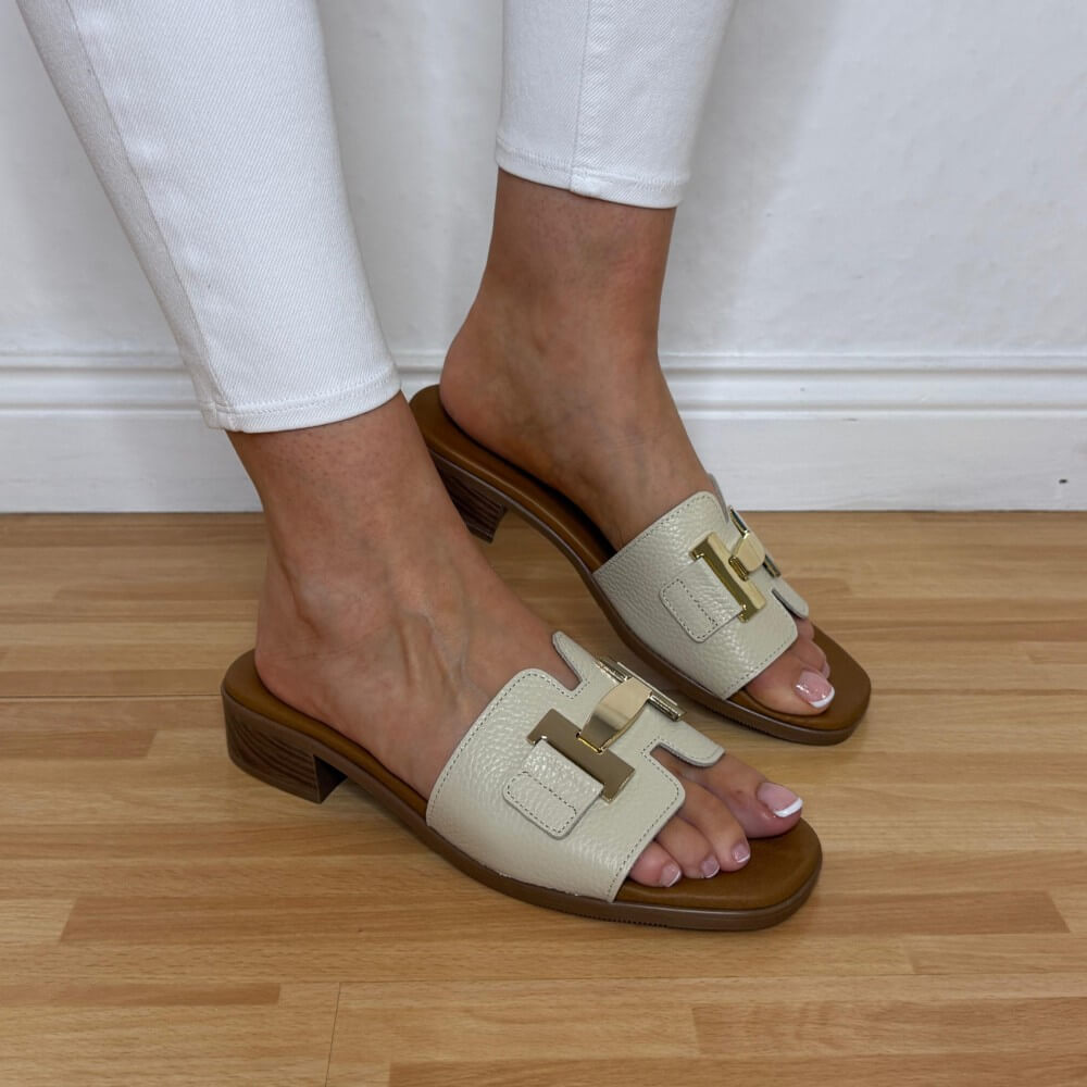 Oh My Sandals 5890 Beige sandals with brown soles worn by a person on a wooden floor.