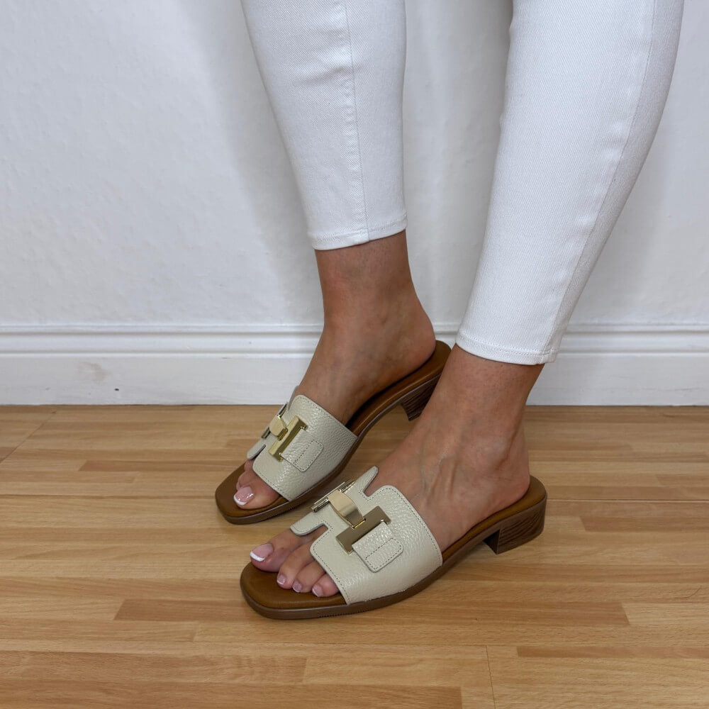 Oh My Sandals 5890 Beige sandals with brown soles worn by a person on a wooden floor.
