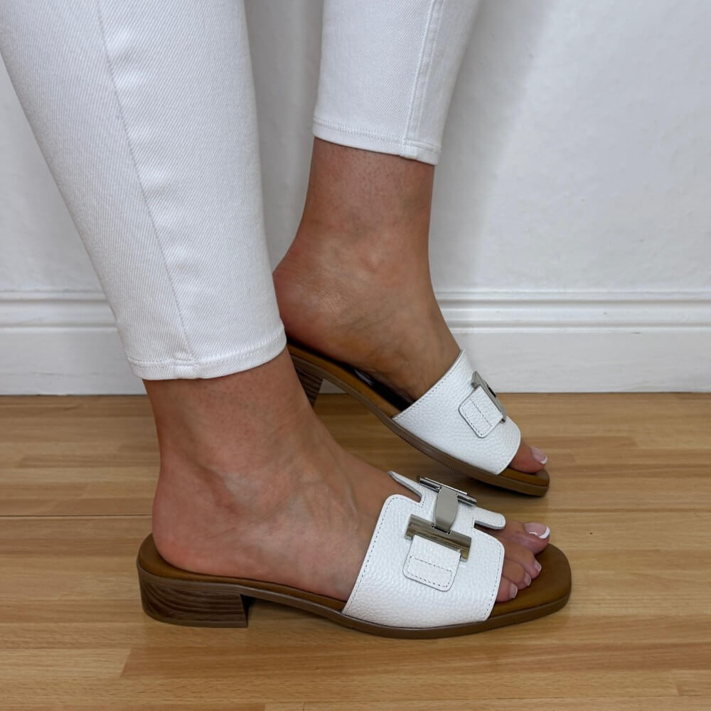 Oh My Sandals 5890 White sandals with brown soles worn on a wooden floor.