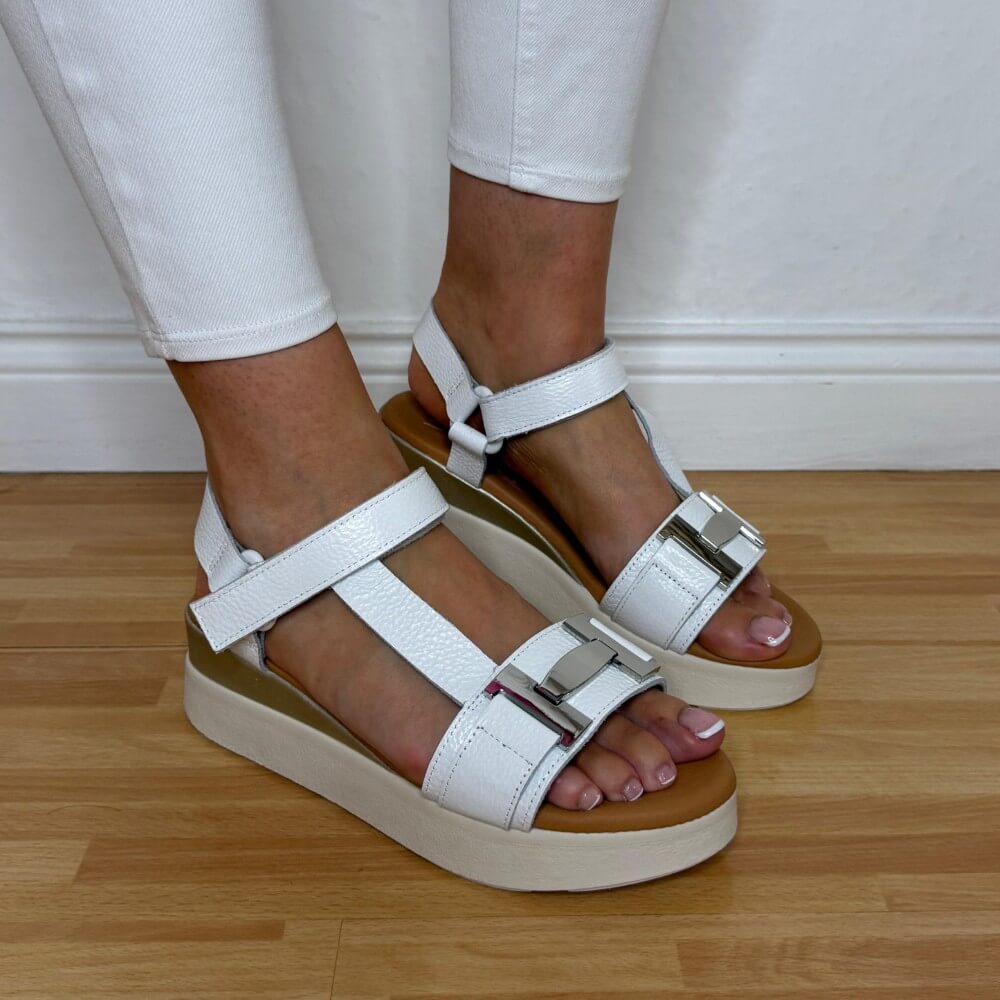 Oh My Sandals 5961 White sandals with beige soles worn by a person on a wooden floor.