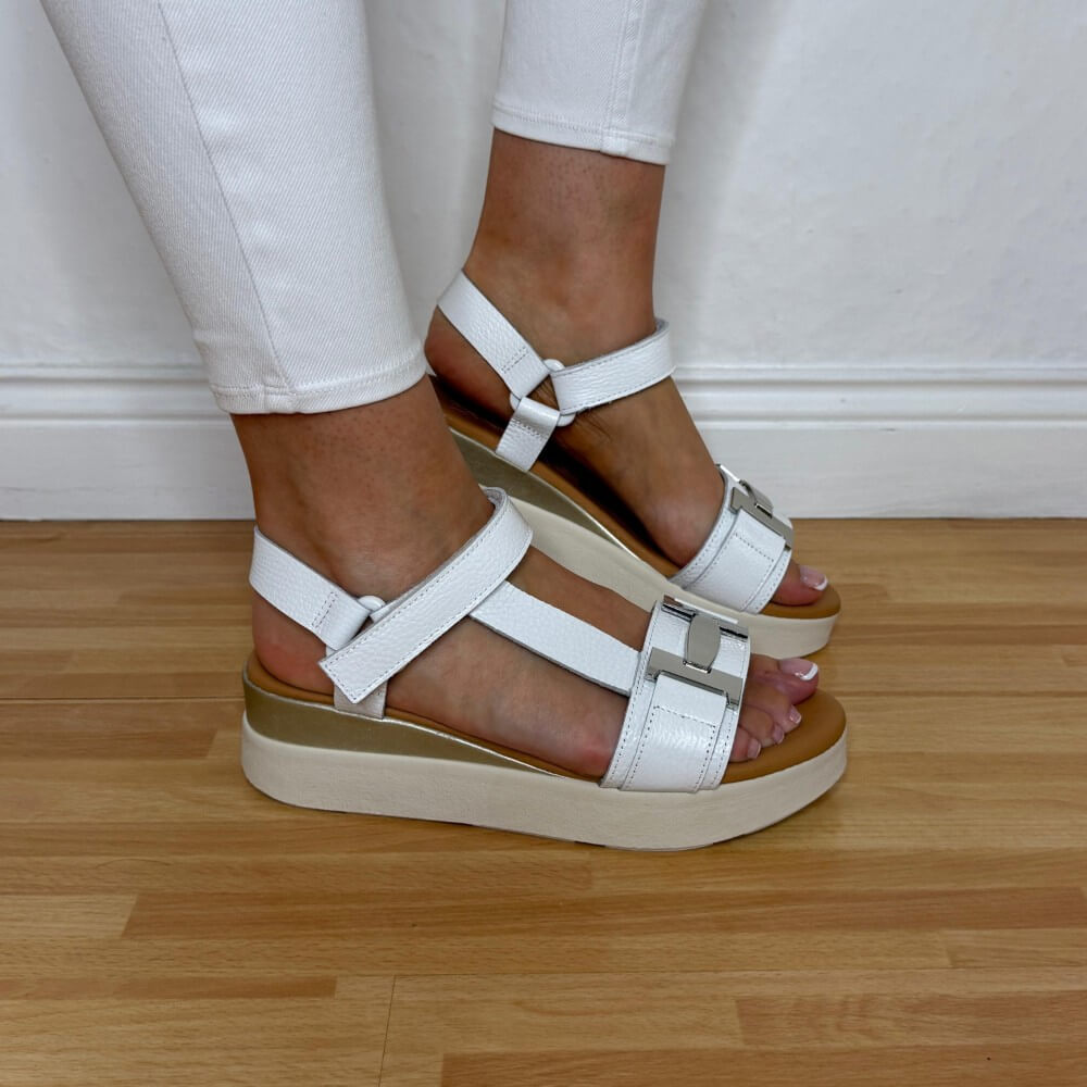 Oh My Sandals 5961 White sandals with beige soles worn by a person on a wooden floor.