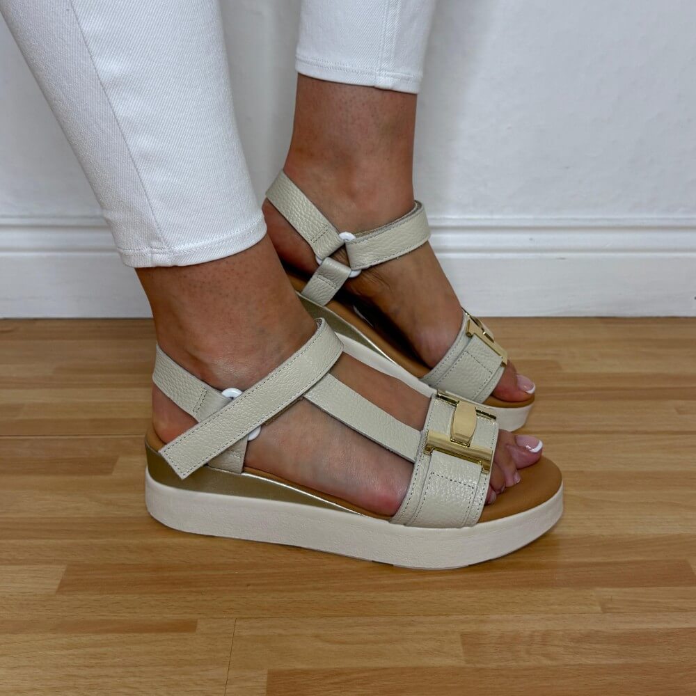 Oh My Sandals 5961 Beige sandals worn with white pants on a wooden floor.