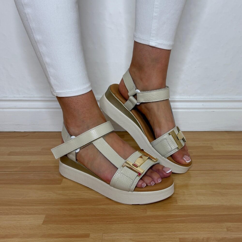 Oh My Sandals 5961 Beige sandals worn with white pants on a wooden floor.
