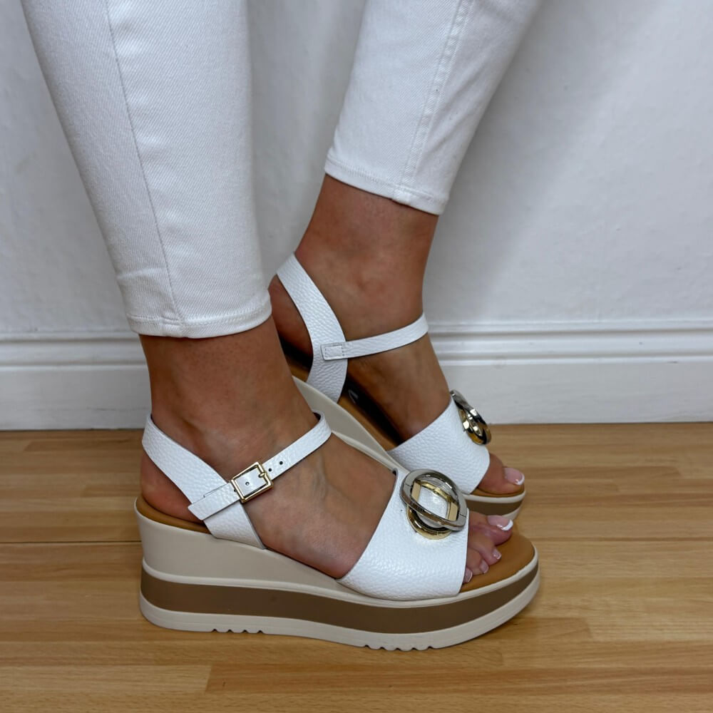 Oh My Sandals 5984 White platform sandals with gold buckles worn by a person on a wooden floor