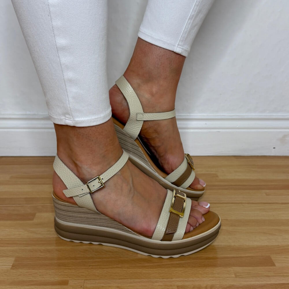 Oh My Sandals 5993 Beige wedge sandals worn with white pants on a wooden floor.