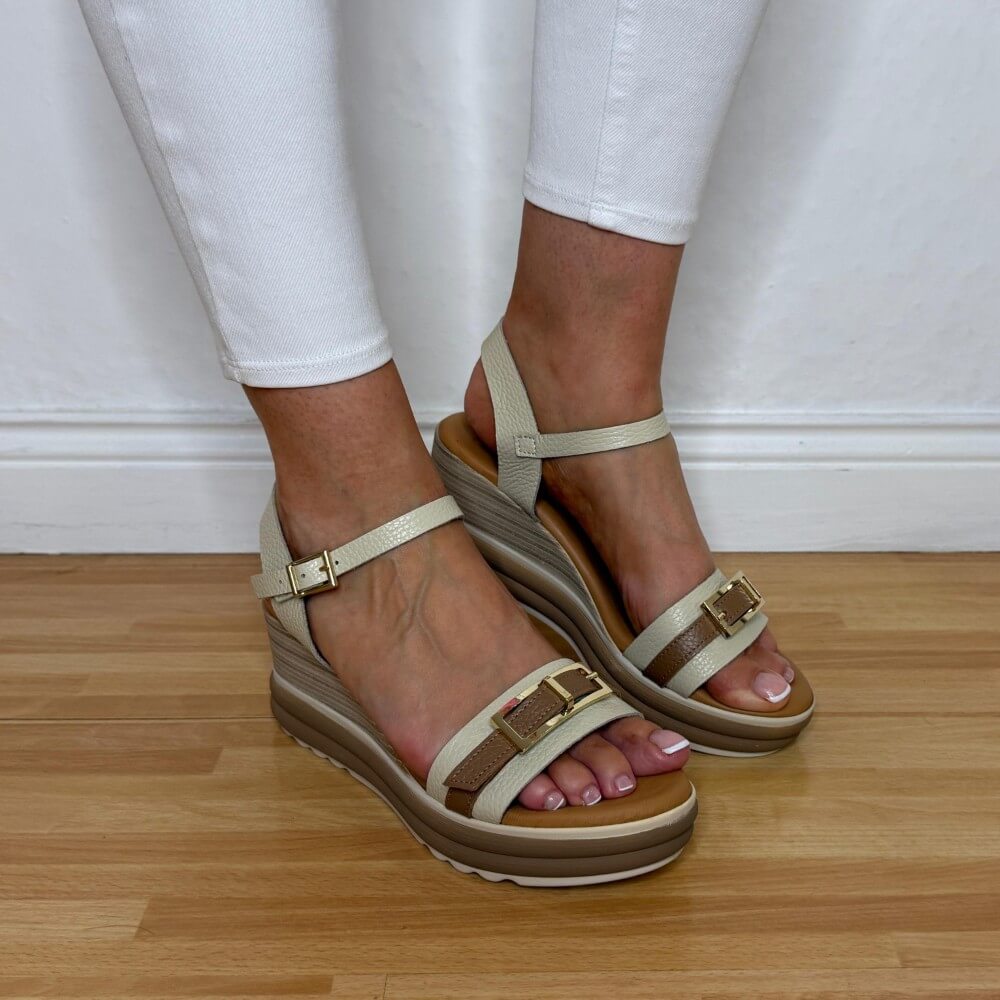 Oh My Sandals 5993 Beige wedge sandals worn with white pants on a wooden floor.