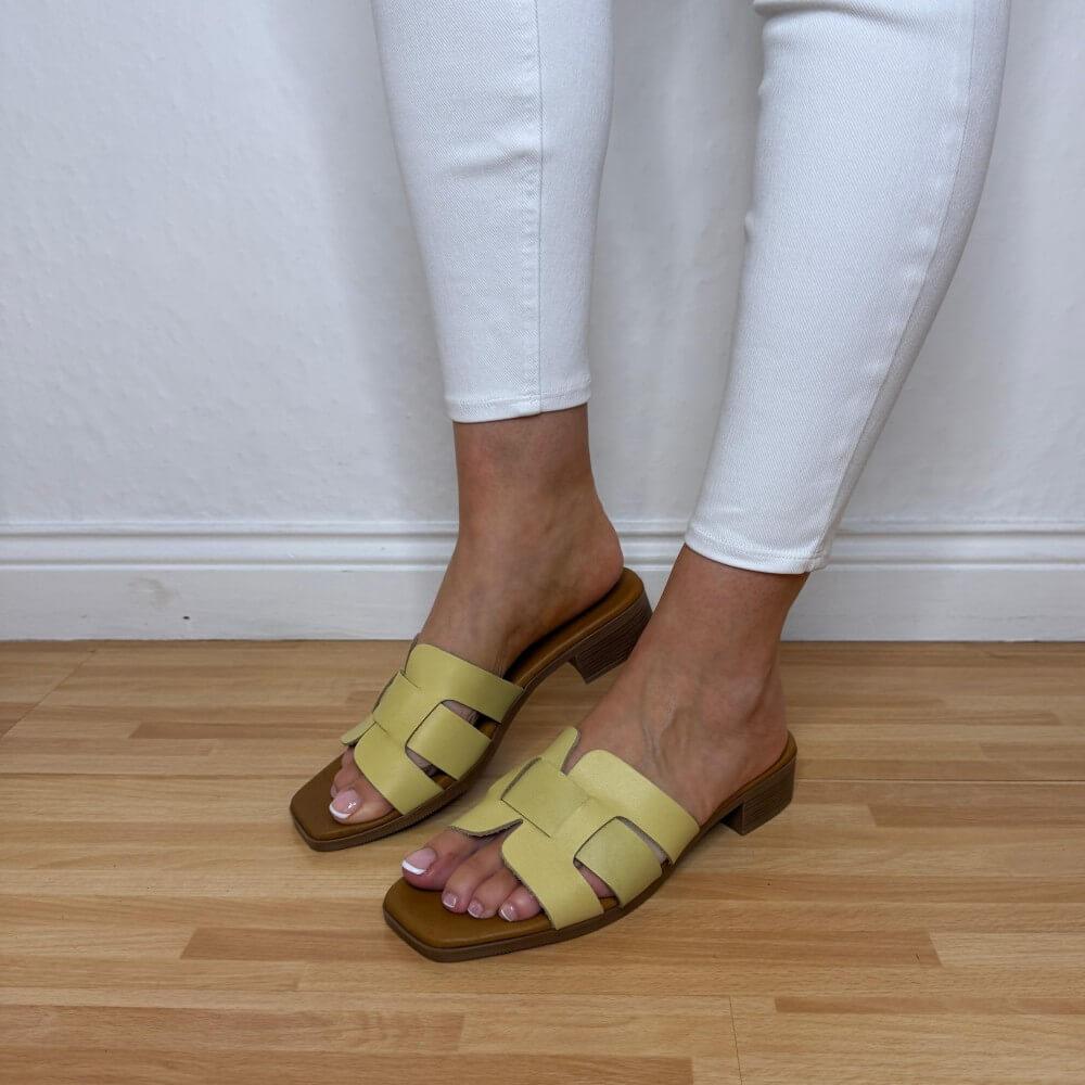 Oh My Sandals 5880 Lemon Yellow Leather sandals with brown soles worn on a wooden floor.