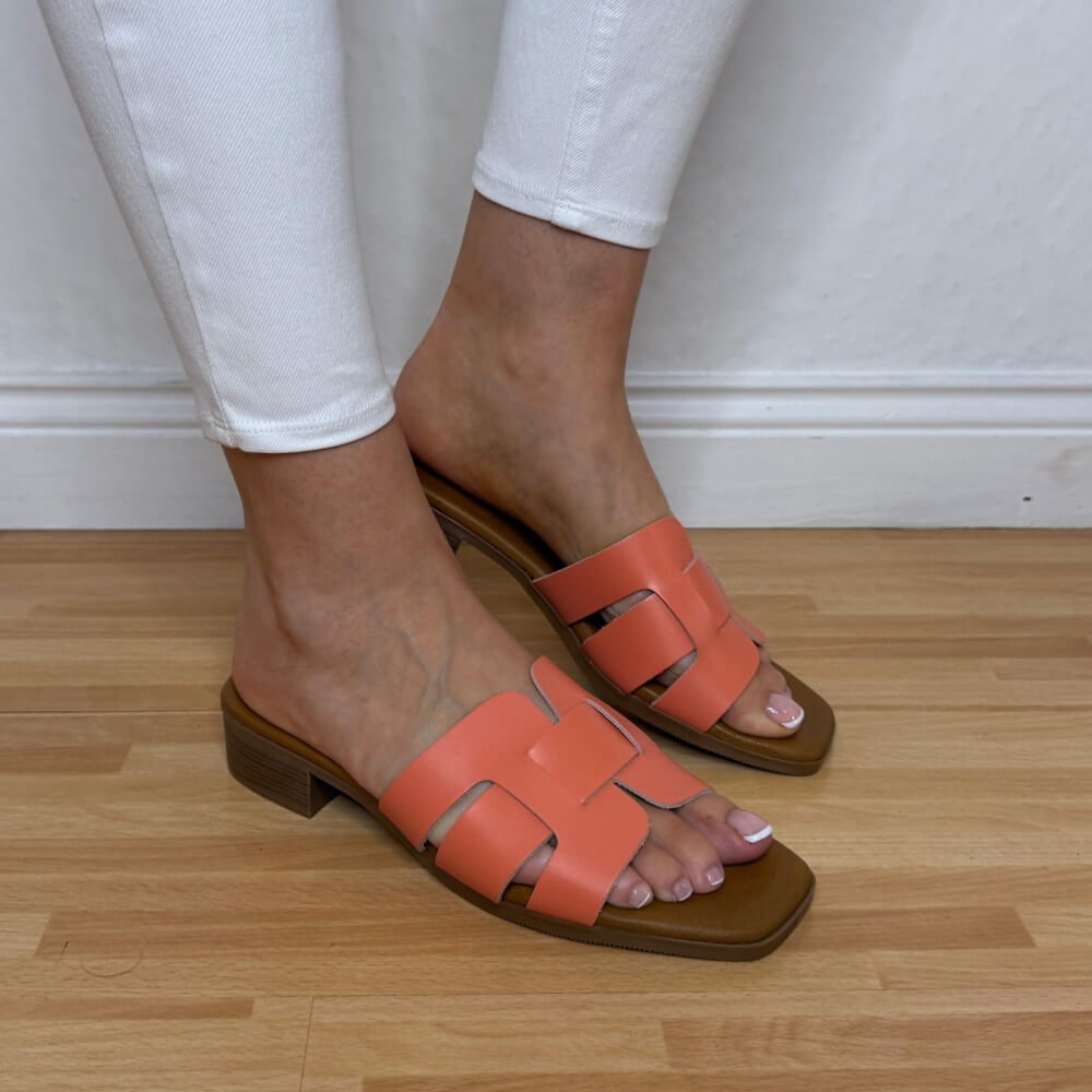 Oh My Sandals 5880 Coral Orange Leather sandals with brown soles worn on a wooden floor.
