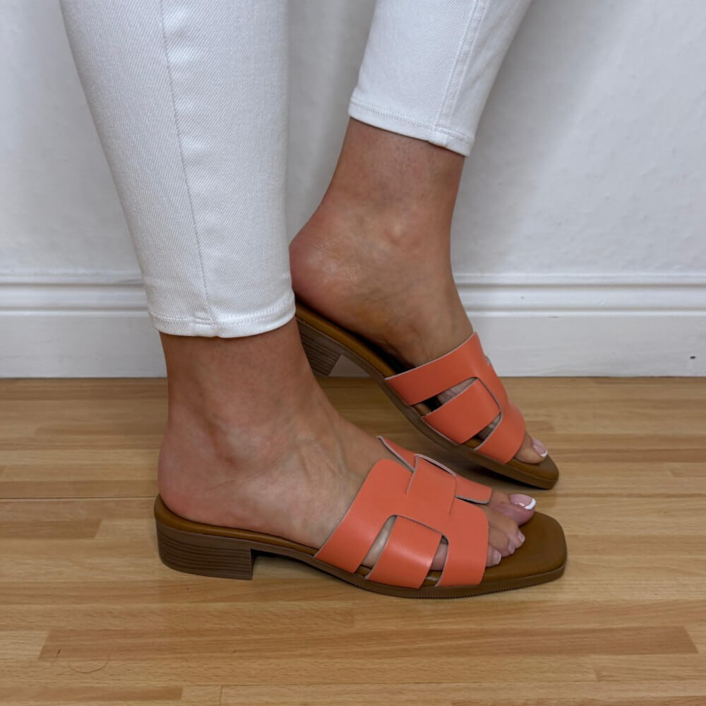 Oh My Sandals 5880 Coral Orange Leather sandals with brown soles worn on a wooden floor.