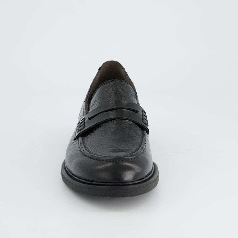 A single black leather loafer shoe photographed from the front against a clean white background.