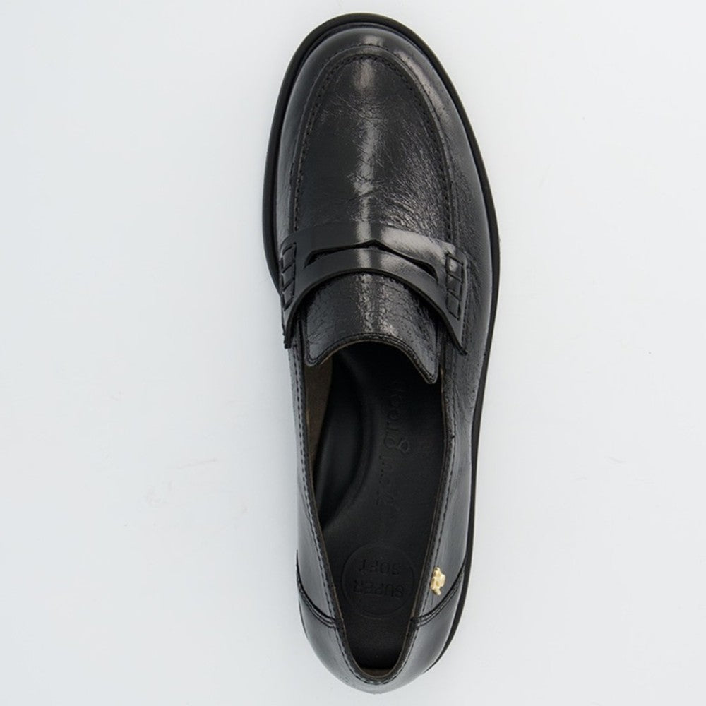 A single black leather penny loafer shown from a top-down view on a clean white background. The shoe features a glossy finish, a decorative strap across the vamp, and a small gold logo accent on the heel.