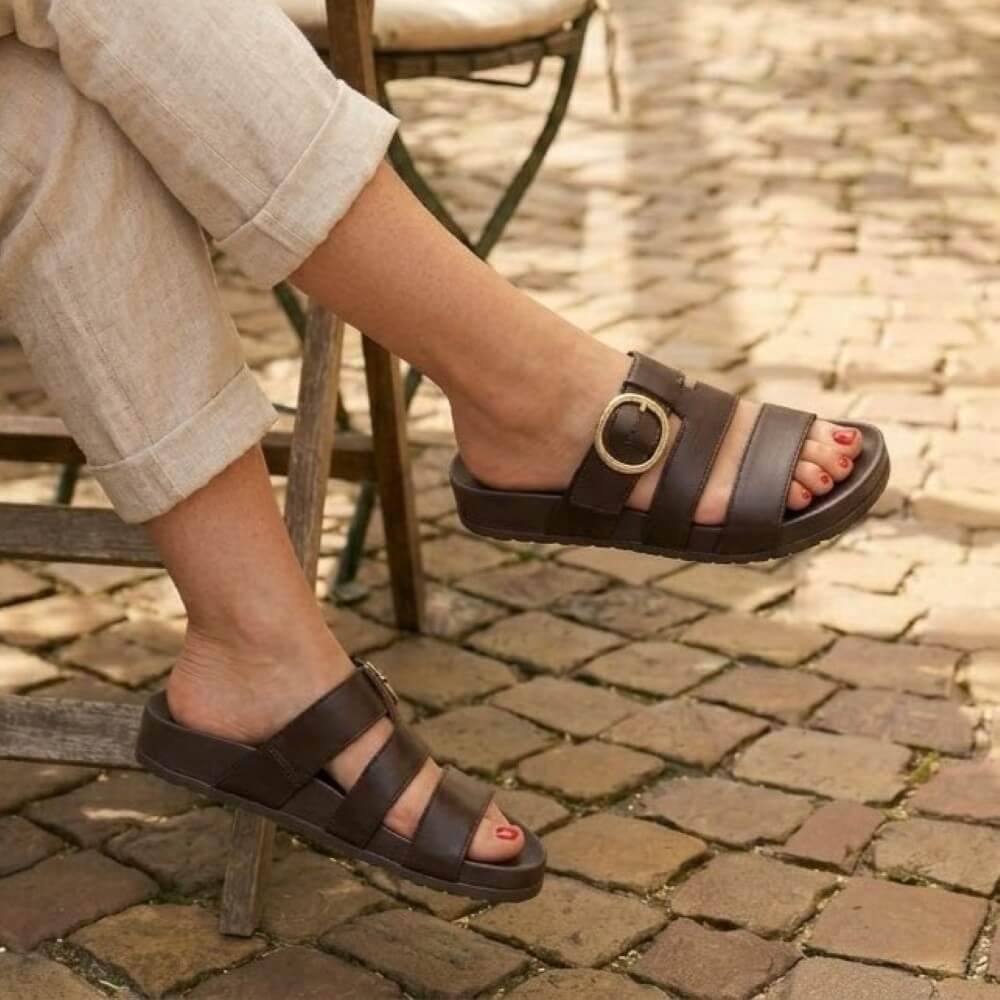 Paul Green 6171 Brown sandals worn on a cobblestone surface