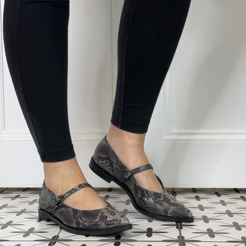 Paul Green 1127 Mary Jane Boa Snake. Gray snake print flats worn with black leggings.