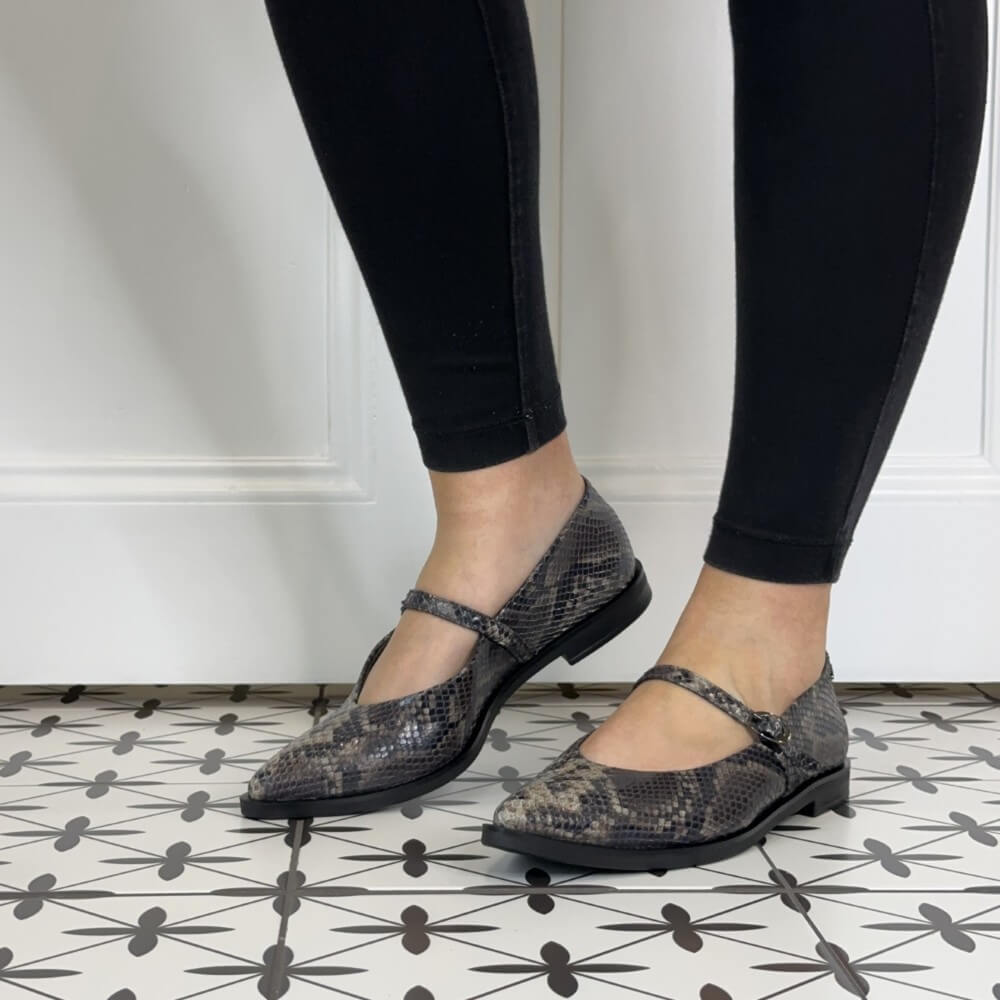 Paul Green 1127 Mary Jane Boa Snake. Gray snake print flats worn with black leggings.