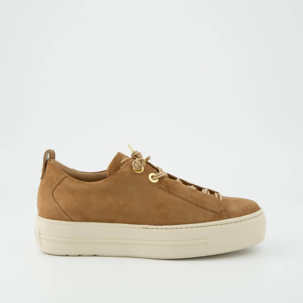 Brown suede sneaker with white sole on a light gray background