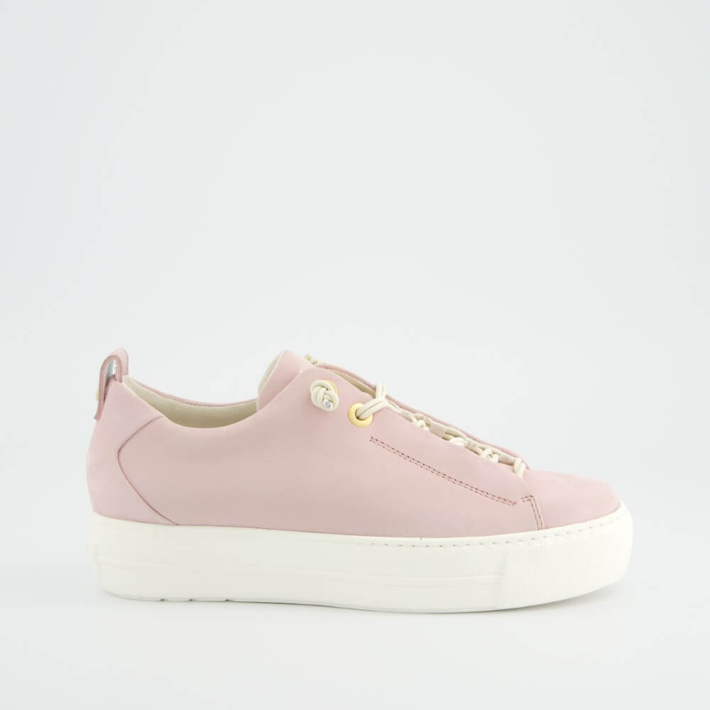 Pink sneaker with white sole on a light gray background