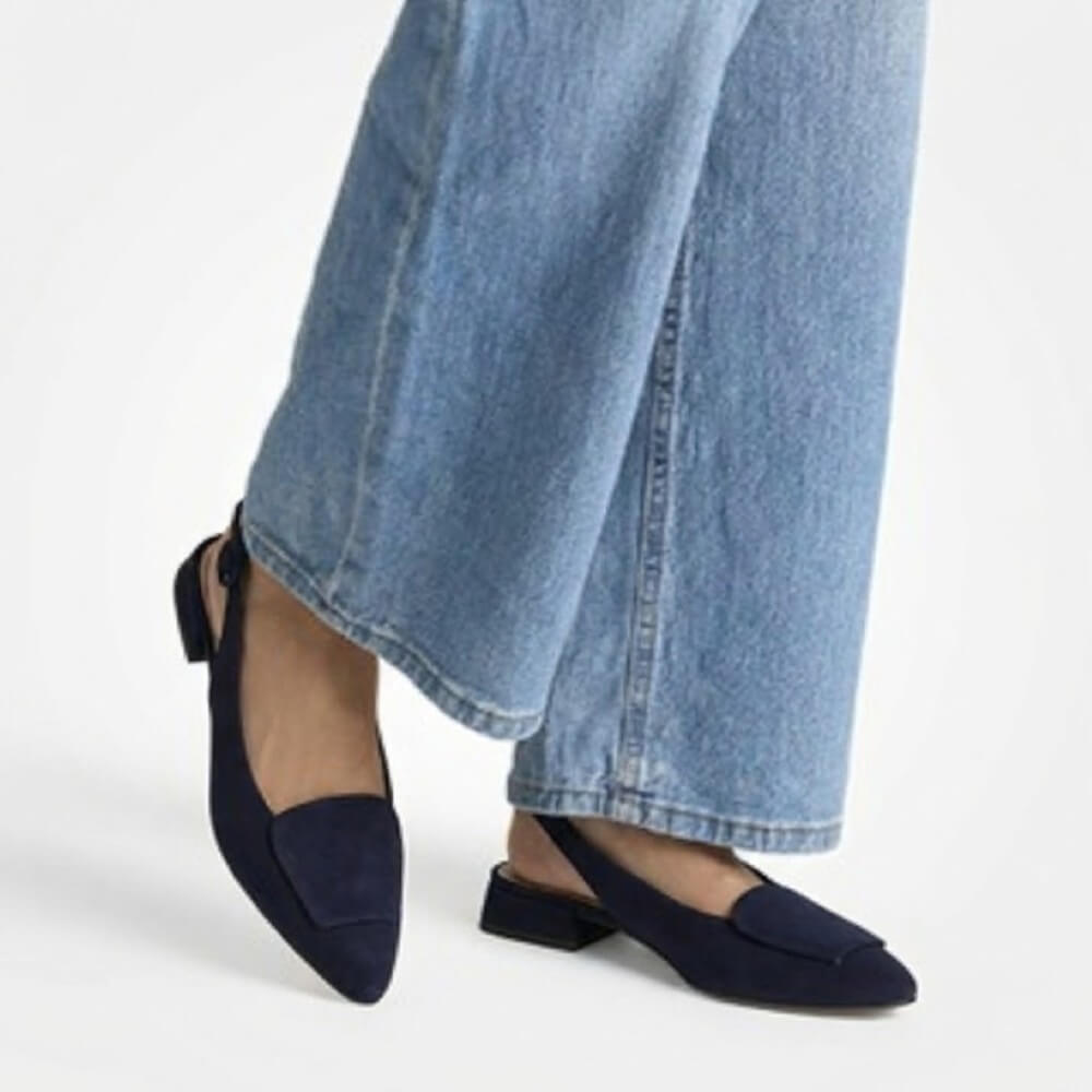 Paul Green 6090 Navy shoes worn with light blue jeans on a white background