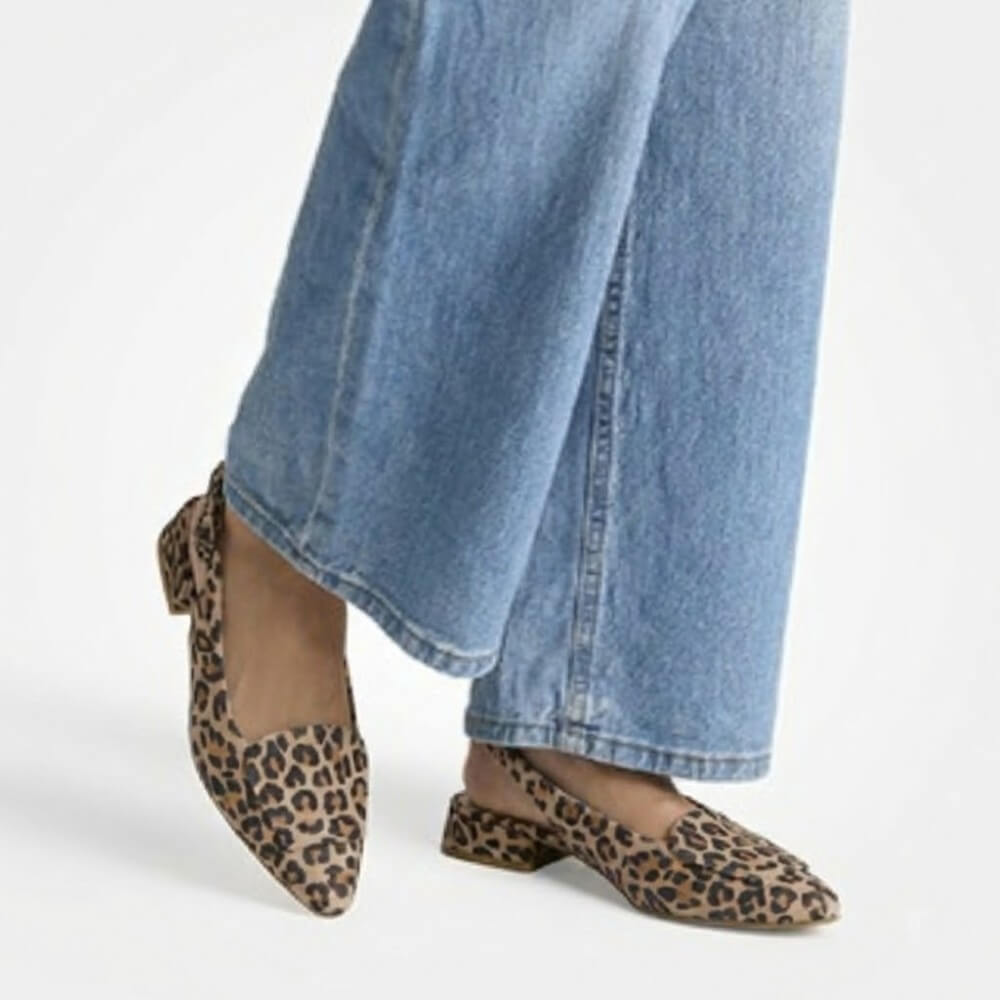 Paul Green 6090 Leopard print shoes worn with blue jeans on a white background
