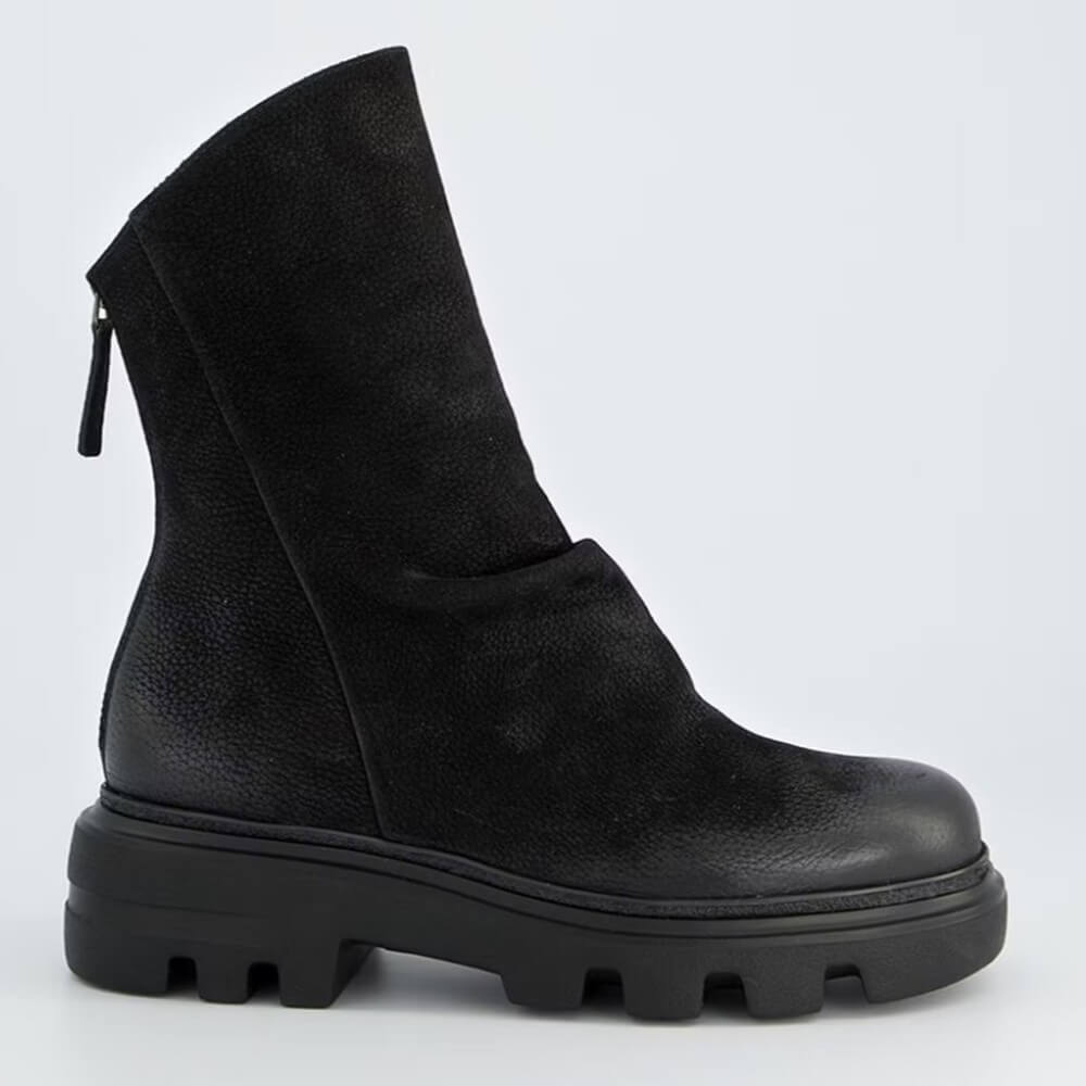 Black suede ankle boot with a back zipper and a thick sole on a light gray background