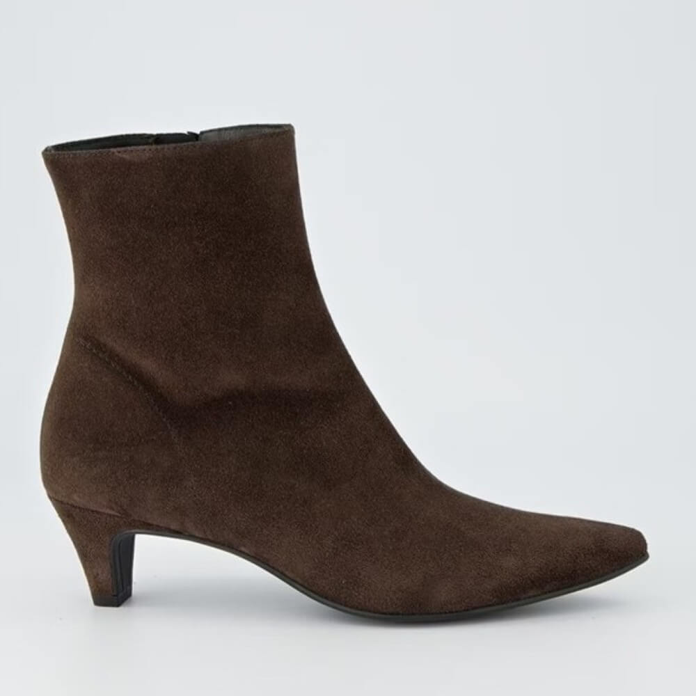 Brown ankle boot on a light gray background