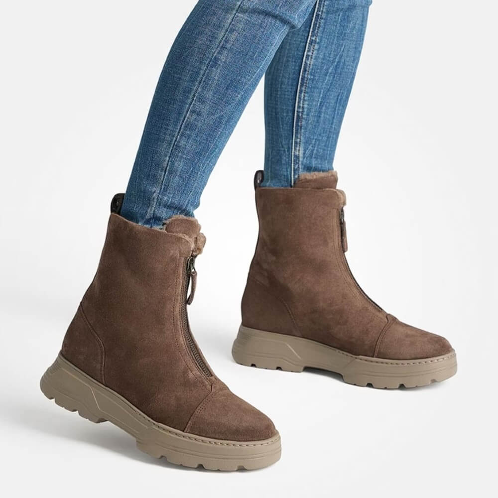 Brown suede ankle boots worn with blue jeans on a white background Paul Green Soft Suede Ankle Boot 8243 Earth Brown