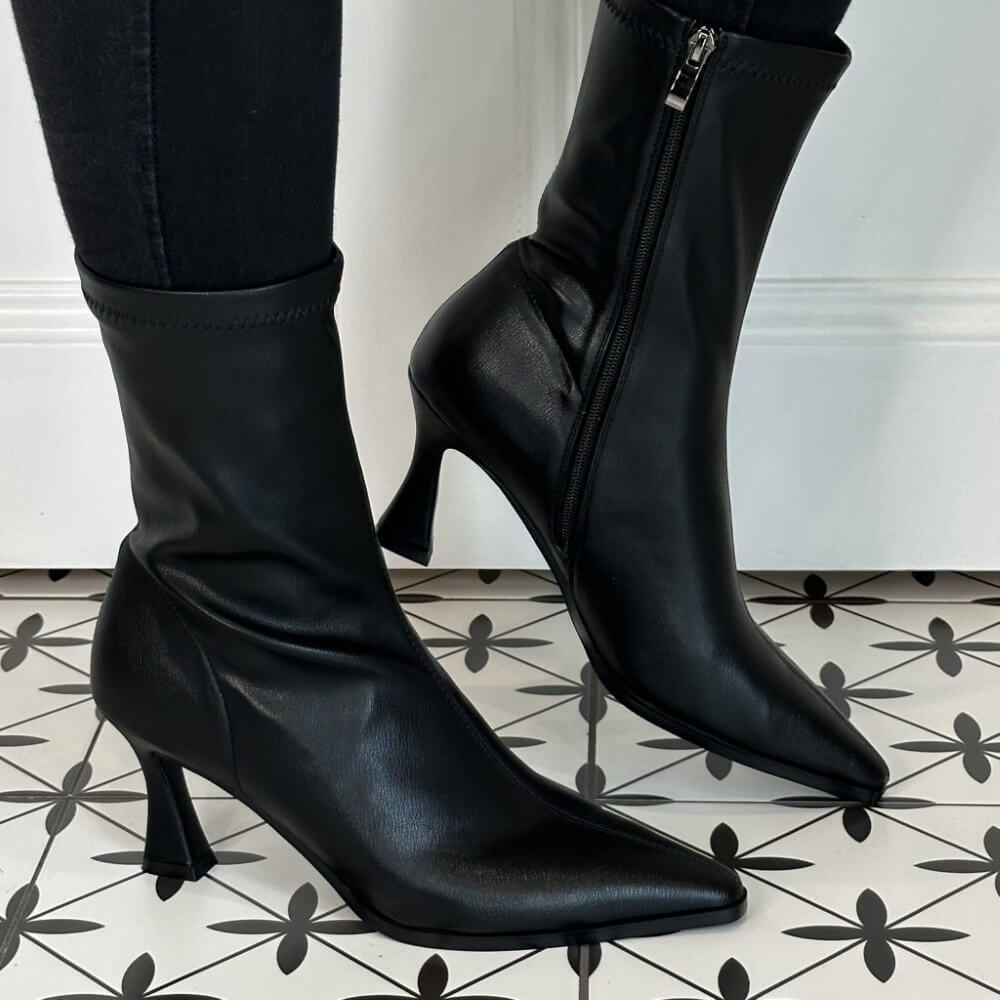 Black high-heeled boots on a patterned floor Pedro Anton Cork Heel Sock Boot Black