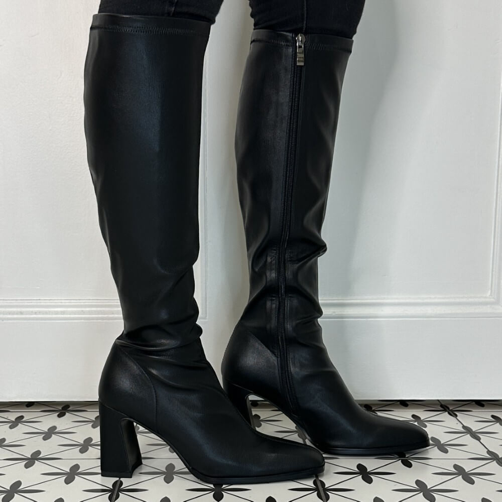 Person Wearing Knee high black boots 